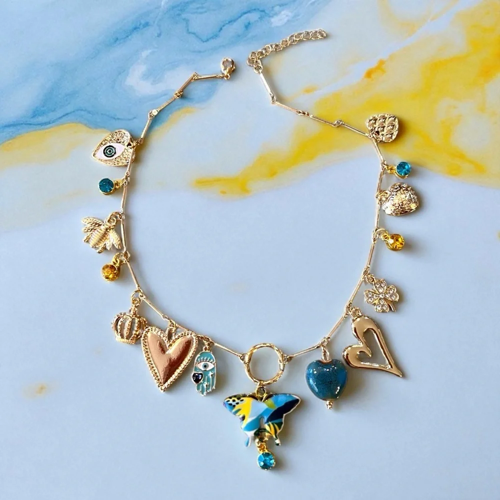 Unique and Gorgeous Gold toned Necklace with Varying Blue and Yellow Charms